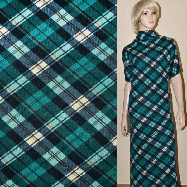 Трикотаж в бирюзово-кремовые и темно-синие ромбы ш.170