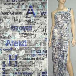 Трикотаж серый светлый с прозрачными полосами и синими надписями ш.150