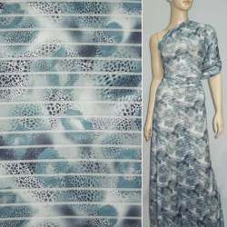 Трикотаж серый светлый с прозрачными полосами и бирюзово-черными пятнами ш.150