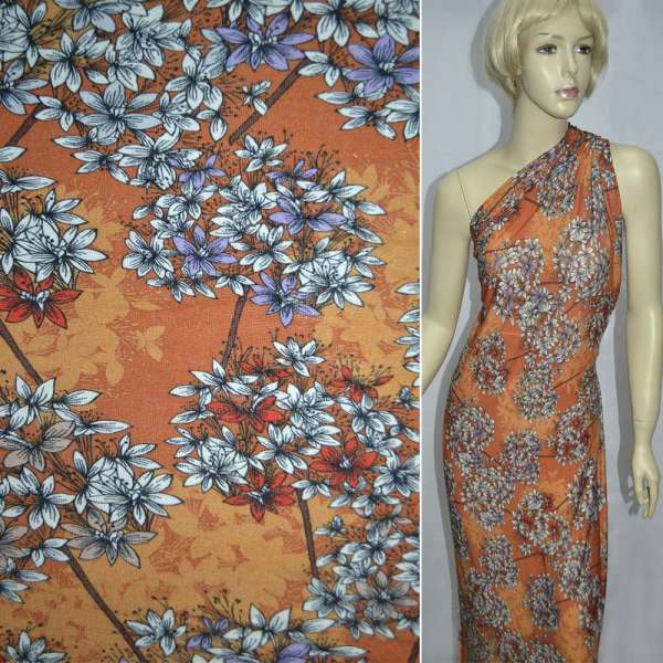 Трикотаж вискозный стрейч оранжевый с фиолетово-белыми букетами цветов ш.140