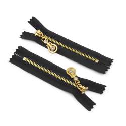 Молния металл М-9 неразъемная х/б золотистые зубцы, бегунок со стразами черная