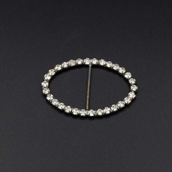 Пряжка неразъемная со стразами металл 30мм овальная 35х52мм серебристая