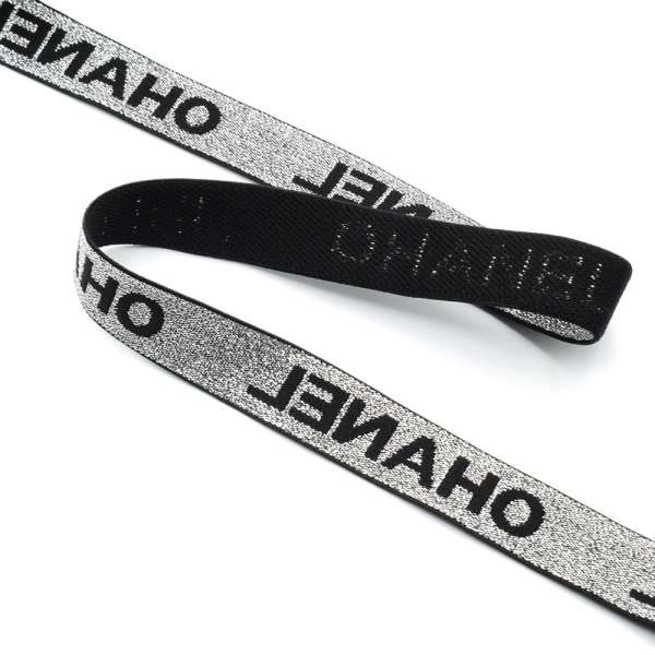 Резинка 20мм серебристая с черными буквами с люрексом