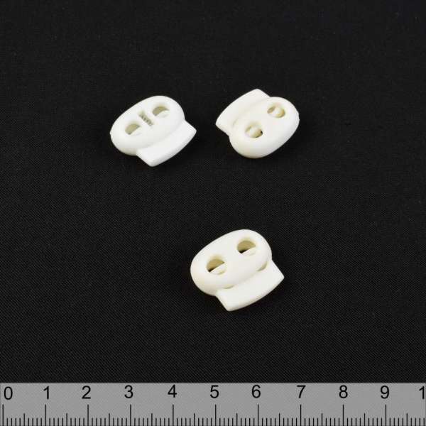 Фиксатор пластик 2 отверстия 4 мм овальный 22мм молочный