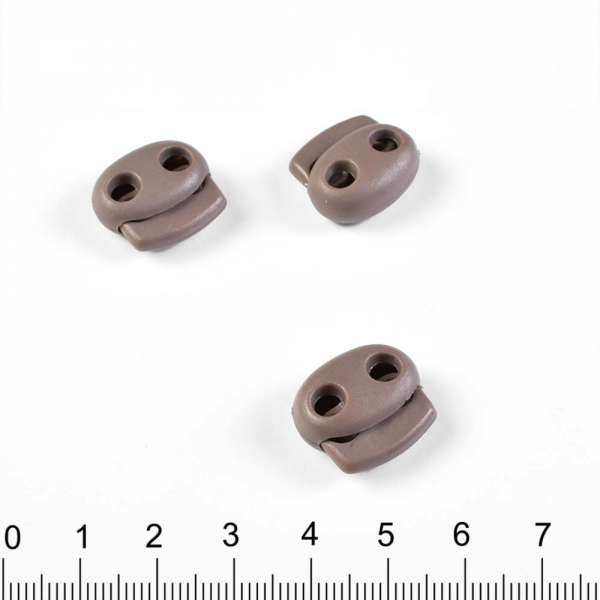Фиксатор пластик 2 отверстия 4 мм овальный 22мм коричневый