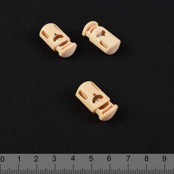 Фиксатор пластик 1 отверстие 4мм бочонок 19мм бежевый