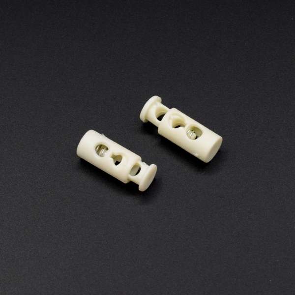 Фиксатор пластик 2 отверстия 4мм бочонок 17мм молочный