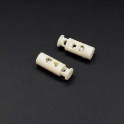 Фиксатор пластик 2 отверстия бочонок 20мм молочный