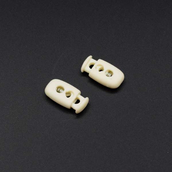 Фиксатор пластик 2 отверстия бочонок 15мм молочный