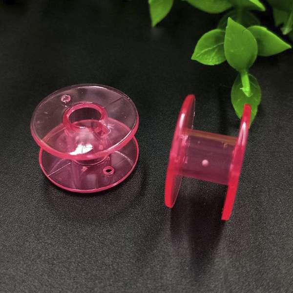 Шпулька пластикова для побутових машин рожева